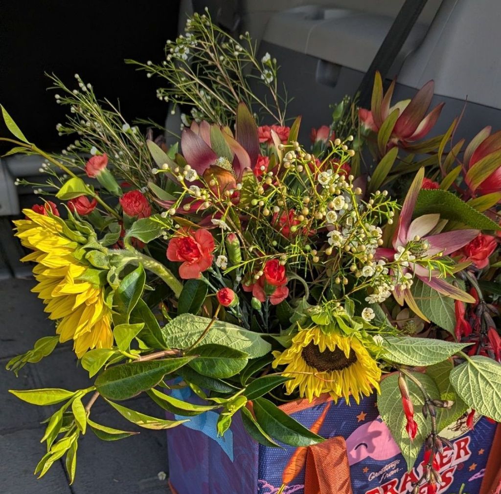 Bunch of flowers in a shopping back.